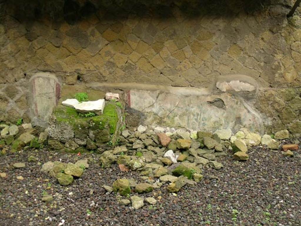 Ins. Orientalis II.4, Herculaneum, December 2004. 
Remains of painted decoration, towards the north end of the west side of east wall of rectangular area. Photo courtesy of Nicolas Monteix.
