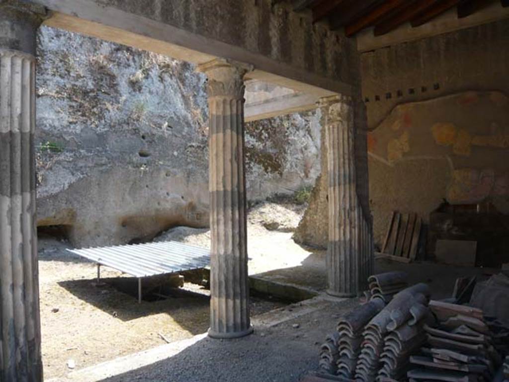 Ins. Orientalis II 4, Herculaneum, August 2013. Looking south-east across south end of west portico, towards the unexcavated. Photo courtesy of Buzz Ferebee.
