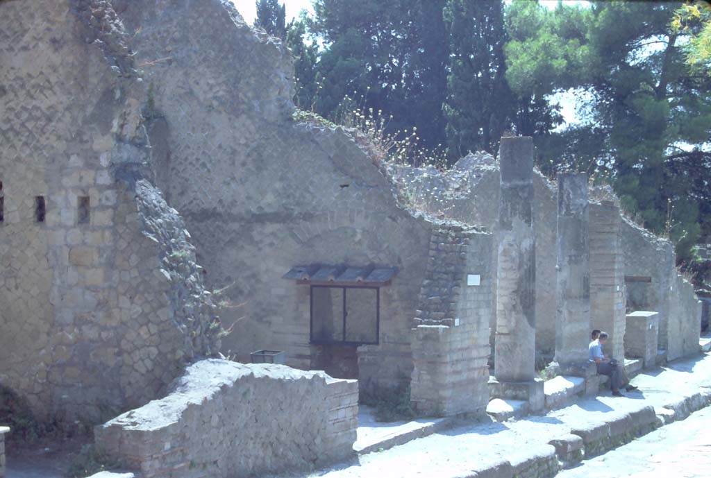 Cardo V, Herculaneum. 7th August 1976. Looking south towards Ins. Or. II.5, second doorway from left, on east side of roadway.
Photo courtesy of Rick Bauer, from Dr George Fay’s slides collection.


