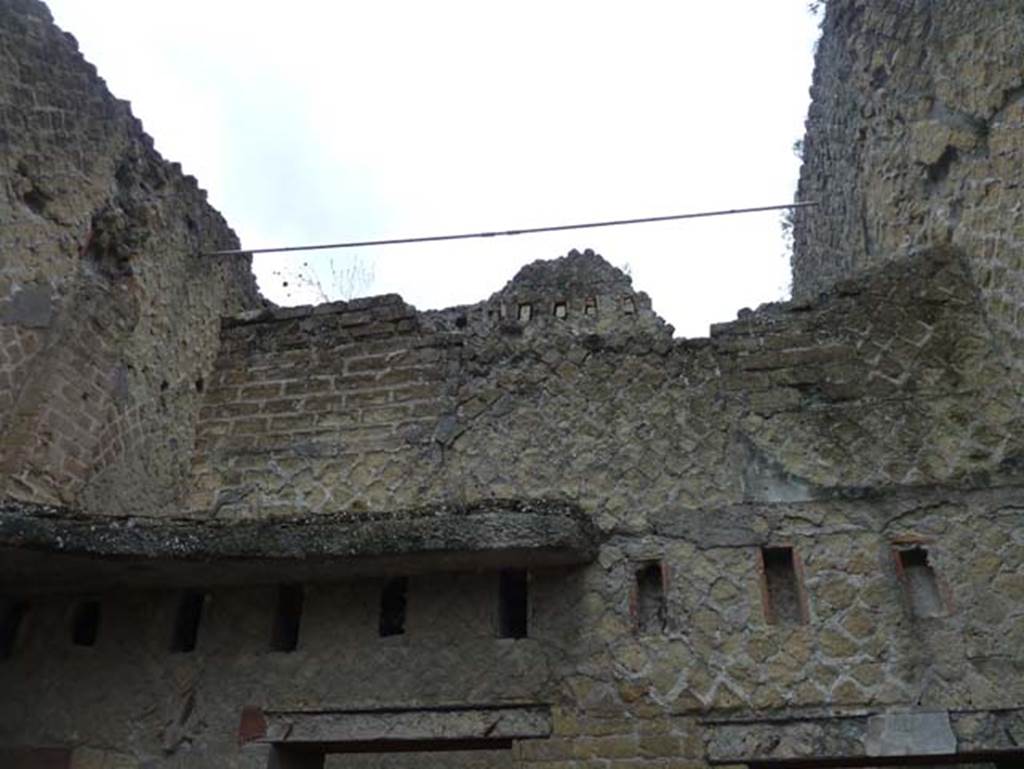 Ins. Orientalis II.5, Herculaneum. September 2015. 
East wall of workshop with support beam holes for the mezzanine floor. 
