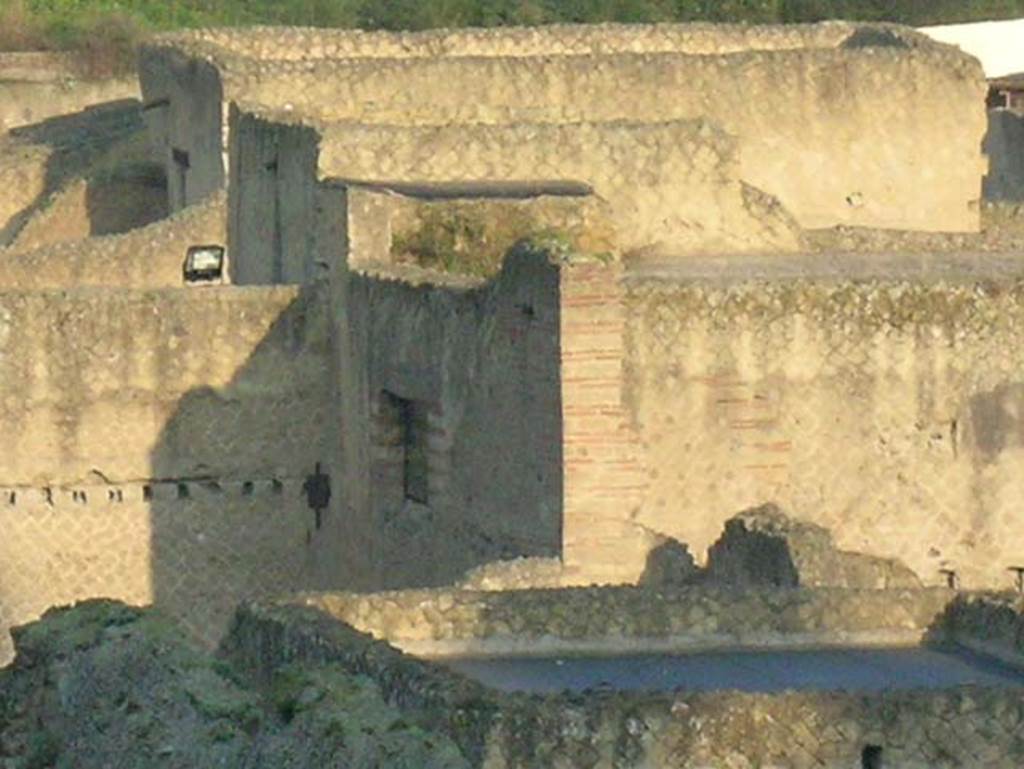 Ins.Or.II. 9/8, Herculaneum. December 2004. Looking north-west from upper floor of Palaestra block across the rooftops of Insula V.
The roof to a room in V.30, Casa dellAtrio corinzio (House of the Corinthian Atrium) is in the lower right. 
Photo courtesy of Nicolas Monteix
