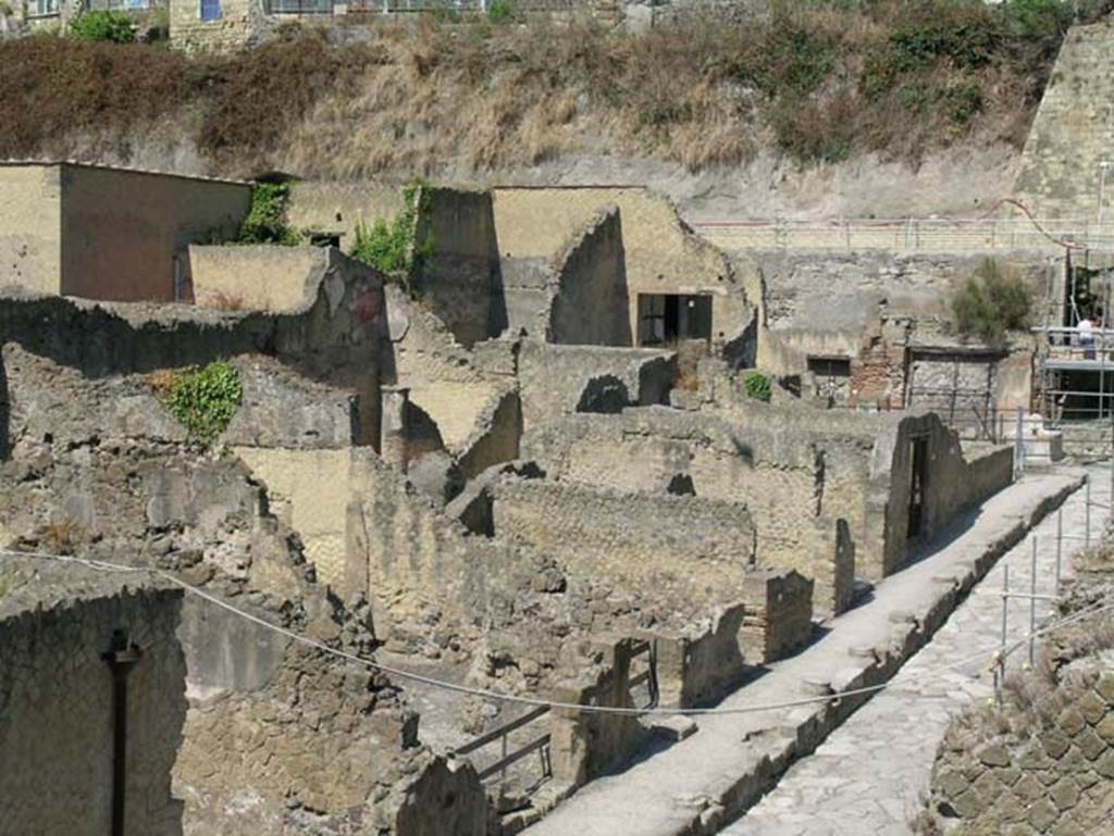 Ins.Or.II. 9/8, Herculaneum. May 2006. Looking north-west from upper floor of Palaestra block towards Insula V on Cardo V.
V.27 centre left, then V.26, V.25, V.24, V.23 and V.22. Upper left of the photo are the upper floors of The House of Bicentenary, V.15.
Photo courtesy of Nicolas Monteix.
