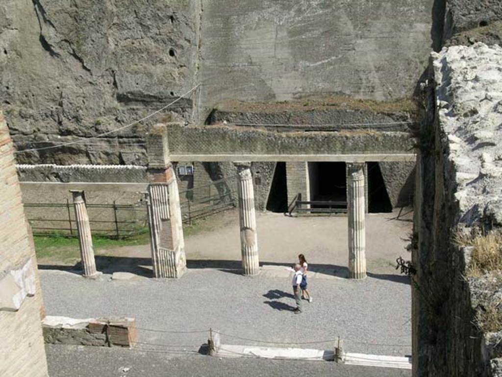 Ins Or II, 4, Herculaneum. May 2006. 
Looking east from upper floor of Palaestra block, across apsed room towards doorway to unexcavated palaestra. 
From upper floor above bakery at Ins.Or.II.8.
Photo courtesy of Nicolas Monteix.
