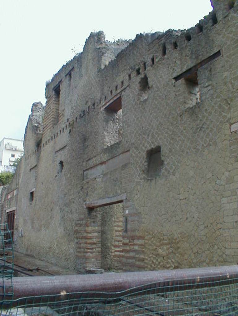 Ins. Orientalis II. 9 on left, and Ins. Or. II.8 in centre. September 2004. Looking north-east along façade. There would have been a wooden balcony, shown by square holes for support beams in wall, between the first and second floor.
