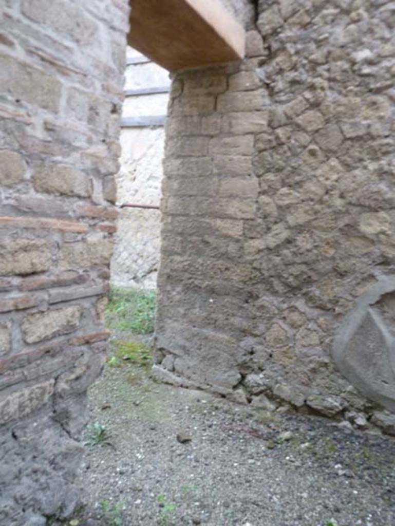 Ins. Orientalis II.10, Herculaneum. September 2015. Looking north-west to doorway from room in Ins. Or. II.11 towards shop-room. 