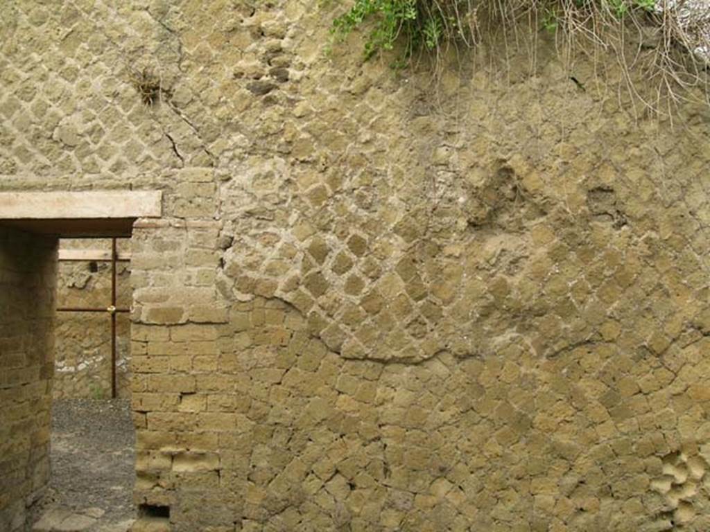 Ins Or II. 13, Herculaneum. June 2005.  North wall of rear room having a doorway to shop-room. 
Photo courtesy of Nicolas Monteix.
