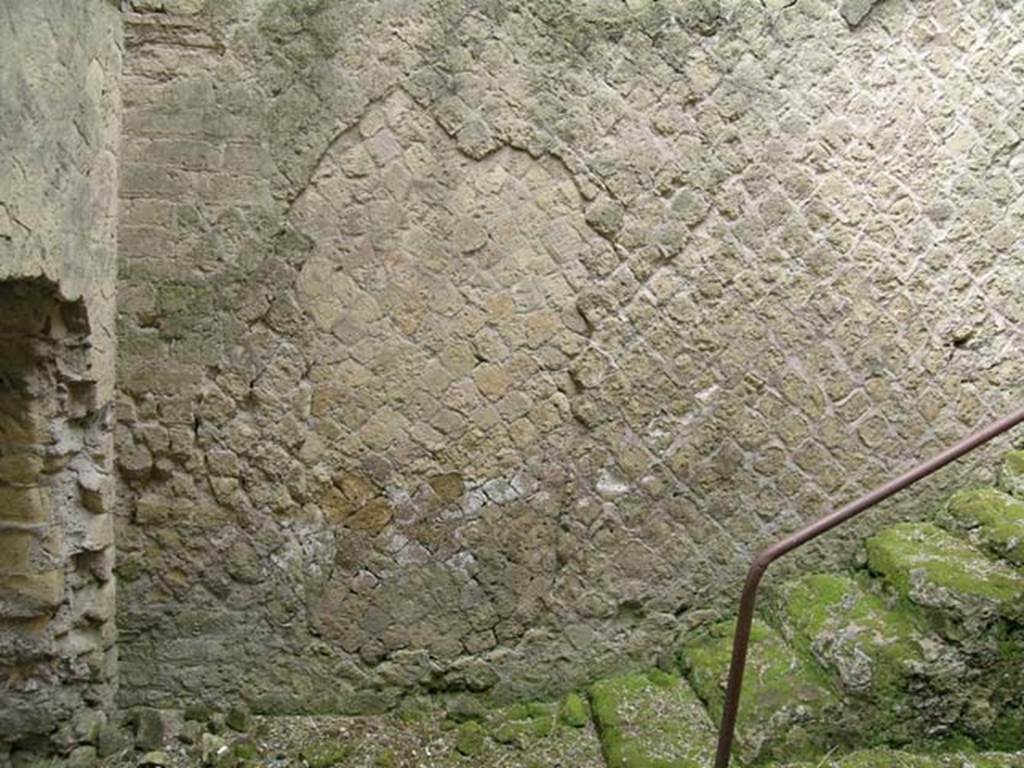 Ins Or II, 15, Herculaneum. May 2004. Rear room, south wall with masonry steps leading up to street level. 
The bricked up doorway is on the left. Photo courtesy of Nicolas Monteix.
