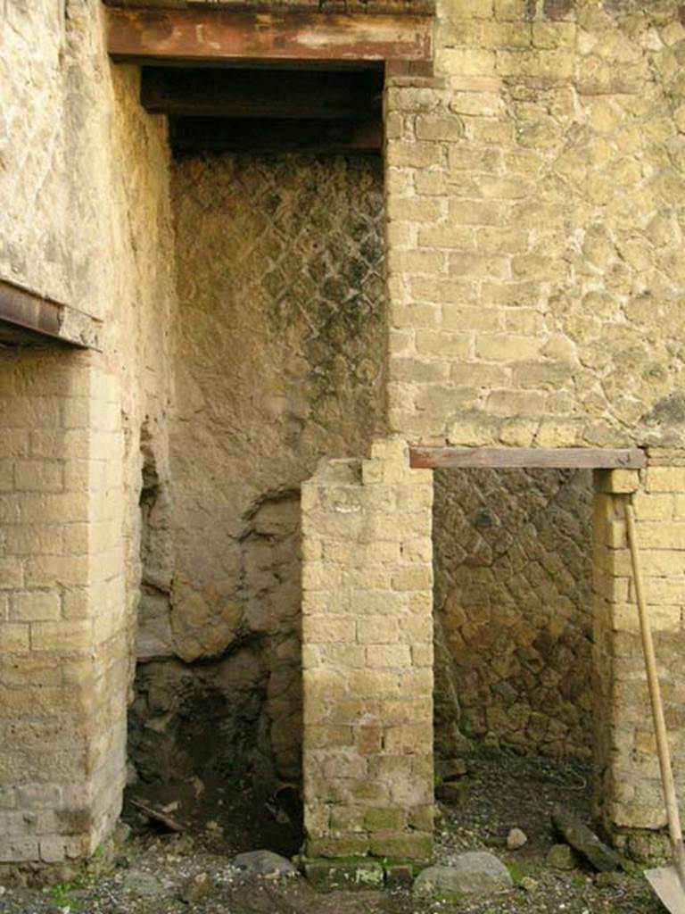 Ins Or II, 18, Herculaneum. December 2004. Looking towards south wall. 
The doorway on the left is to the latrine. The doorway on the right, leads into an area under the stairs at Ins.Or.II.17.
These stairs, according to Maiuri, would have been carved out from an area of this room giving access both to the elevated upper floor rooms on the terrace of the Cryptoporticus, as well as to those looking onto the eastern façade of the Palaestra.
Photo courtesy of Nicolas Monteix.

