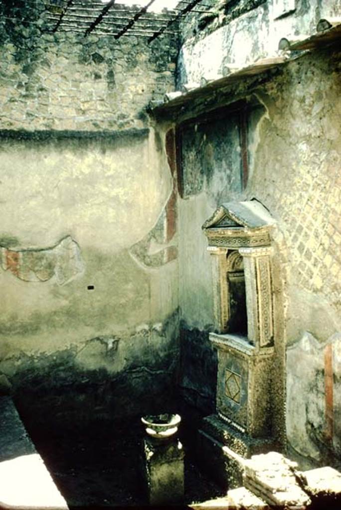 III.3 Herculaneum. 1957. Looking east towards small aedicula nymphaeum with grating above it. Photo by Stanley A. Jashemski.
Source: The Wilhelmina and Stanley A. Jashemski archive in the University of Maryland Library, Special Collections (See collection page) and made available under the Creative Commons Attribution-Non Commercial License v.4. See Licence and use details. J57f0439
