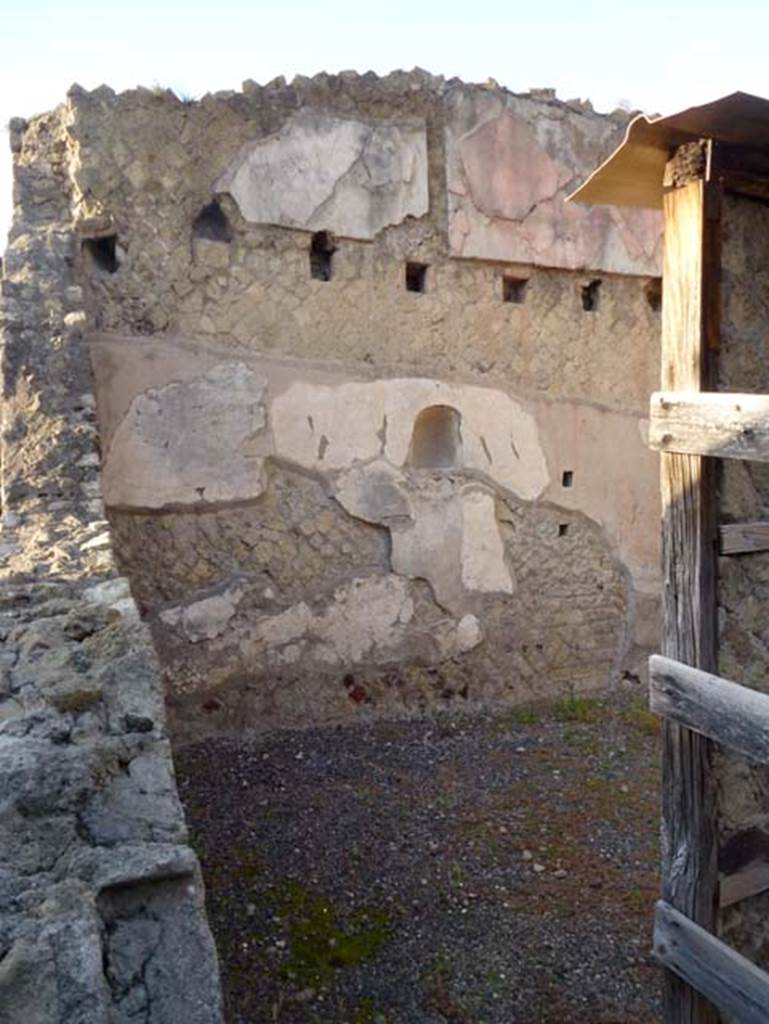 IV.15/16 Herculaneum, October 2012. Looking towards west wall, with niche, of second room (7) for the use of customers.  Photo courtesy of Michael Binns.
