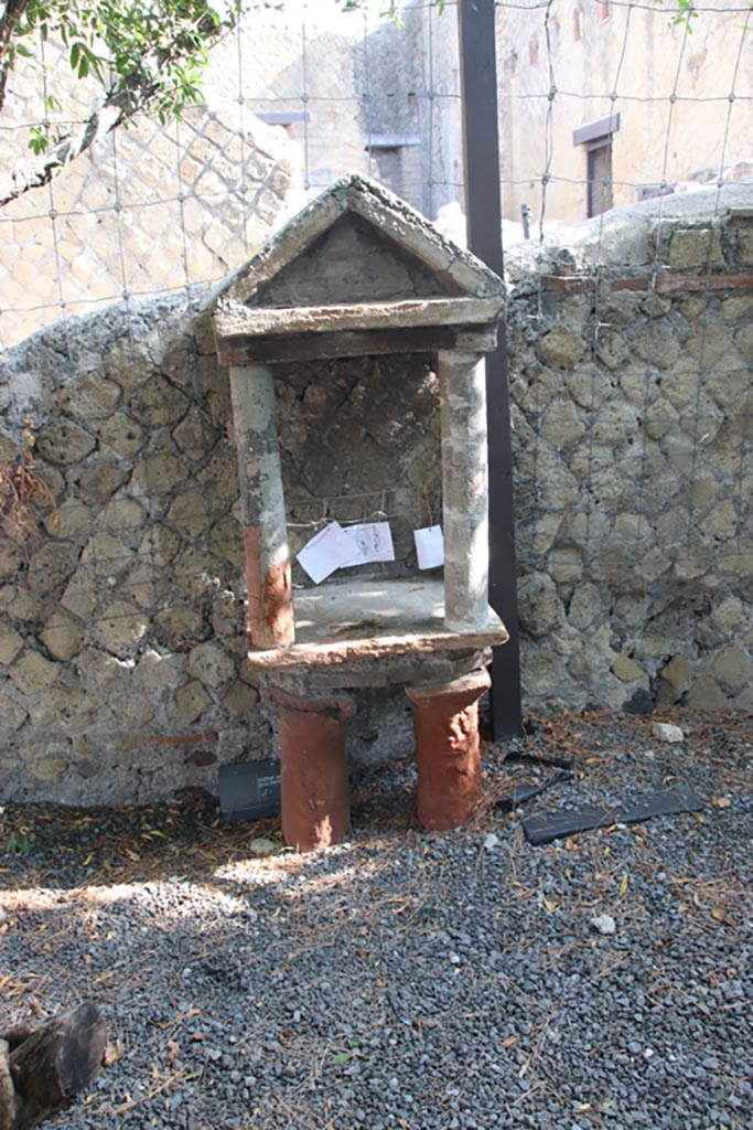 Ins. Orientalis I.3, Herculaneum, October 2023. 
Aedicula lararium against north wall of garden area. Photo courtesy of Klaus Heese.
According to Maiuri –
“The garden to the north of the dwelling, which must have been a later addition, hides here and there in the subsoil the remains of preceding constructions. 
Here, roughly attached to the boundary wall, there is the rustic shrine, dear to the servant who had charge of this humble part of the dwelling.”
See Maiuri, Amedeo, (1977). Herculaneum. 7th English ed, of Guidebooks to the Museums Galleries and Monuments of Italy, No.53 (p.64-66).
