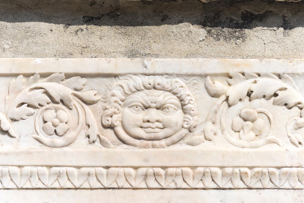 Herculaneum, October 2023. 
Detail of the carving on the south side of altar to Marcus Nonius Balbus on Terrace. Photo courtesy of Johannes Eber. 
