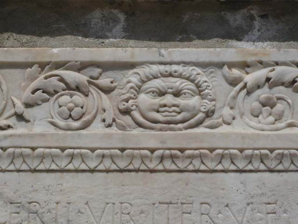 Herculaneum, August 2013. Detail of the carving on the south side of altar to Marcus Nonius Balbus. Photo courtesy of Buzz Ferebee. 
