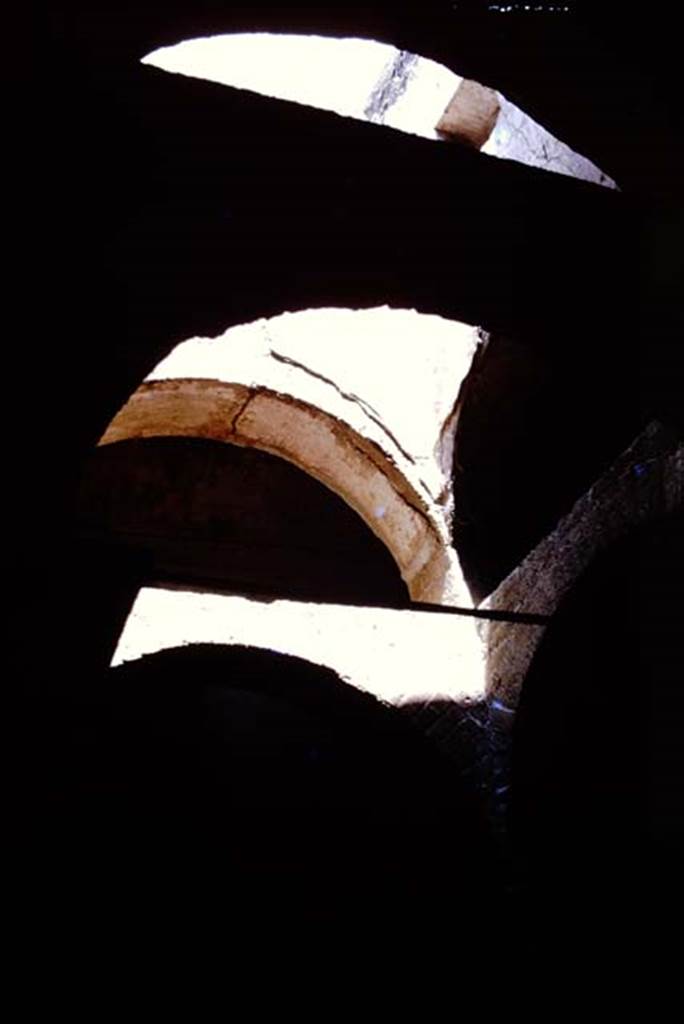 Suburban baths, Herculaneum, 1975. Arches above the atrium. Photo by Stanley A. Jashemski.   
Source: The Wilhelmina and Stanley A. Jashemski archive in the University of Maryland Library, Special Collections (See collection page) and made available under the Creative Commons Attribution-Non Commercial License v.4. See Licence and use details. J75f0728

