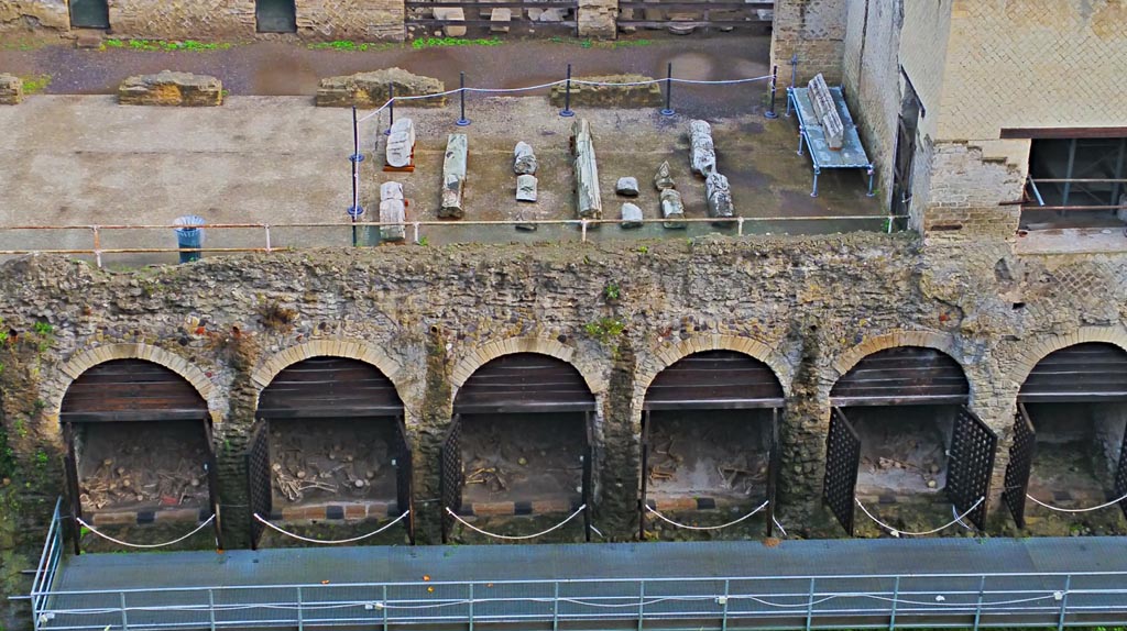 Herculaneum, photo taken between October 2014 and November 2019. 
Looking north towards Sacred Area terrace from access roadway, with boatsheds below. Photo courtesy of Giuseppe Ciaramella.
