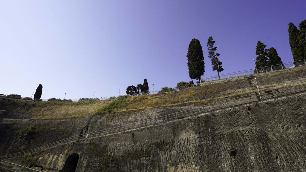 Herculaneum, August 2021. Depth of solidified ash on southside of beachfront, with tunnel exit on lower left. Photo courtesy of Robert Hanson.