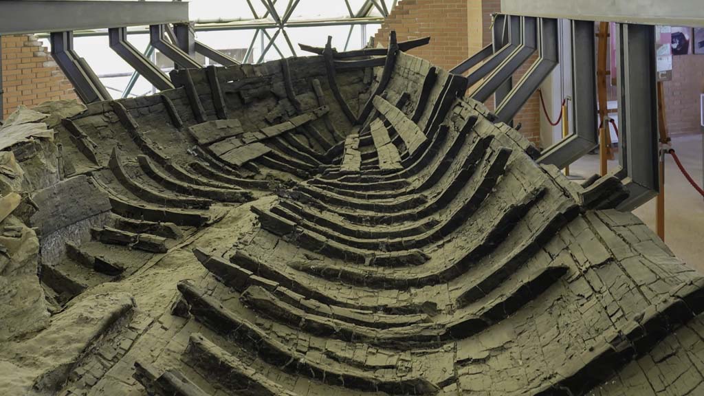 Herculaneum, August 2021. 
Carbonised wooden boat found on 3rd August 1982 on the ancient beachfront. Photo courtesy of Robert Hanson.

