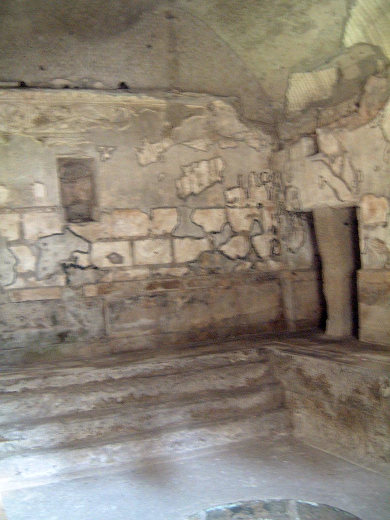 Herculaneum, May 2001. 
Looking towards west wall and north-west corner, with steps at west end of hot pool in the second larger caldarium.
Photo courtesy of Current Archaeology.
