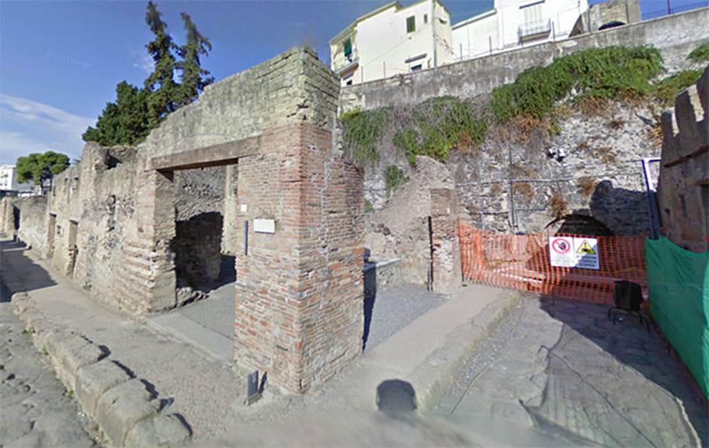 Decumanus Inferiore, on right, Herculaneum. May 2010. Looking west with Ins. II.6 and II.7 doorways, centre. On the left is Cardo III Inferiore.
