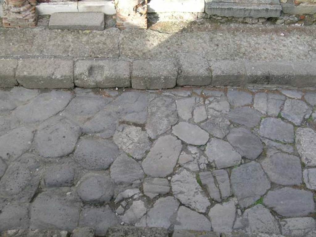 Decumanus Inferiore, Herculaneum. May 2004. Looking north across roadway towards doorway to V.35, and V.34.
Photo courtesy of Nicolas Monteix.
