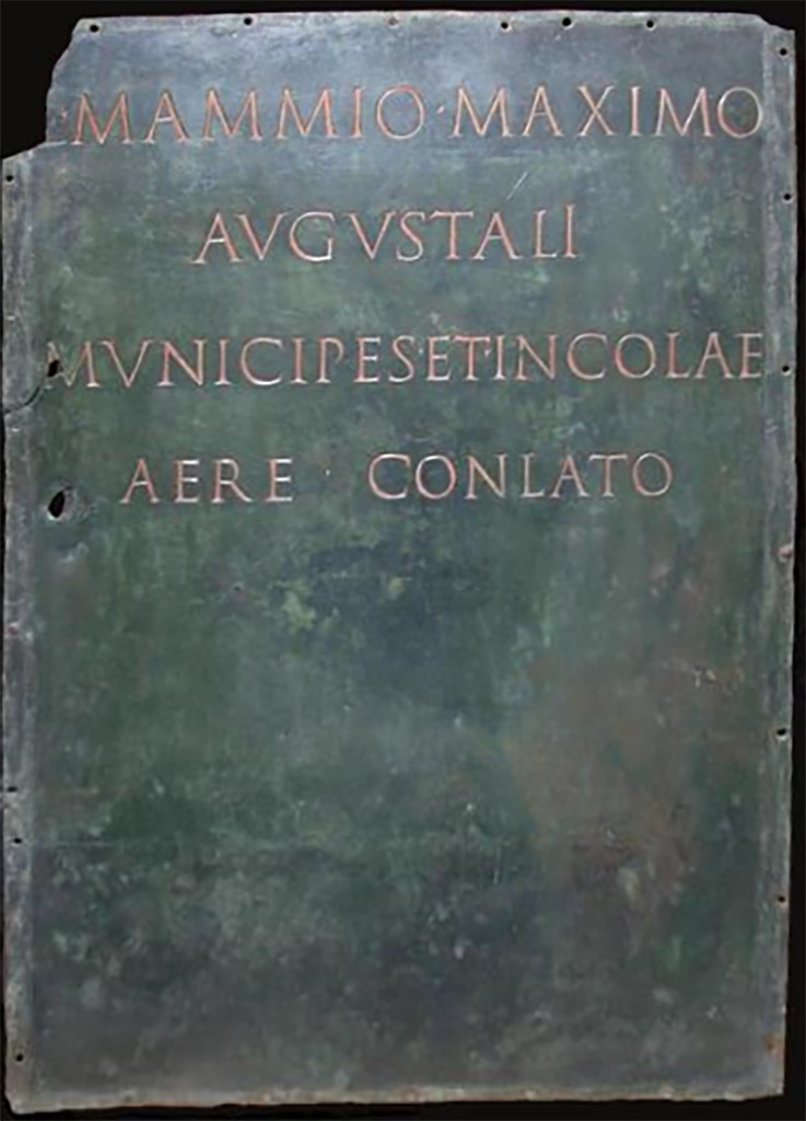 Herculaneum theatre. Dedication to Lucius Mammius Maximus, probably from the base of the bronze statue inv. 5591.
L(ucio) Mammio Maximo,
Augustáli,
municipes et incolae
aere conlato.

Citizens and resident foreigners funded, by public subscription, a statue in honour of the augustalis Lucius Mammius Maximus.

Now in Naples Archaeological Museum. Inventory number 3748.
