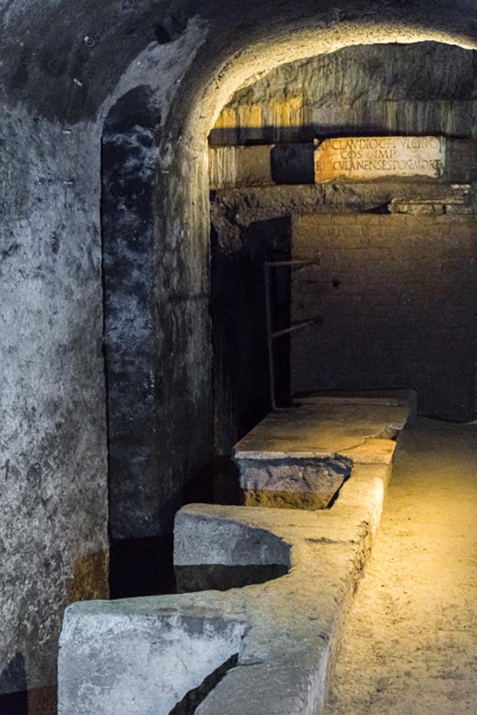 Herculaneum Theatre. October 2023. 
Looking across west end of the proscenium towards base with honorary inscription. Photo courtesy of Johannes Eber. 
