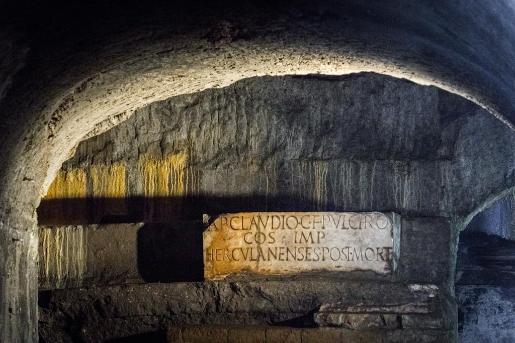 Herculaneum Theatre. October 2023. 
Inscription to AP Claudio C F Pulchro after his death, in situ underground. Photo courtesy of Johannes Eber. 
