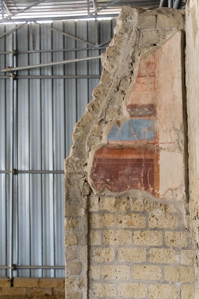 Herculaneum Villa dei Papiri. October 2023. 
Room (d), detail of painted decoration from west wall at north end. Photo courtesy of Johannes Eber. 
