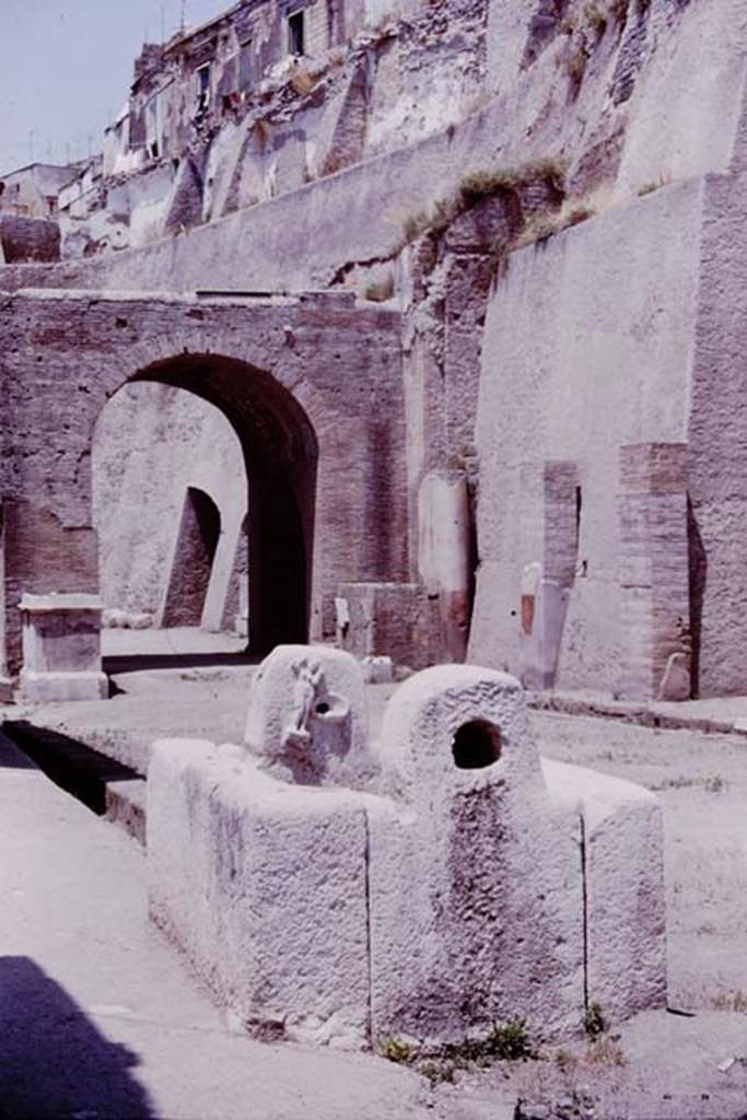 Fountain of Venus, Decumanus Maximus, Herculaneum. 1964. 
Photo by Stanley A. Jashemski.
Source: The Wilhelmina and Stanley A. Jashemski archive in the University of Maryland Library, Special Collections (See collection page) and made available under the Creative Commons Attribution-Non-Commercial License v.4. See Licence and use details.
J64f1156
