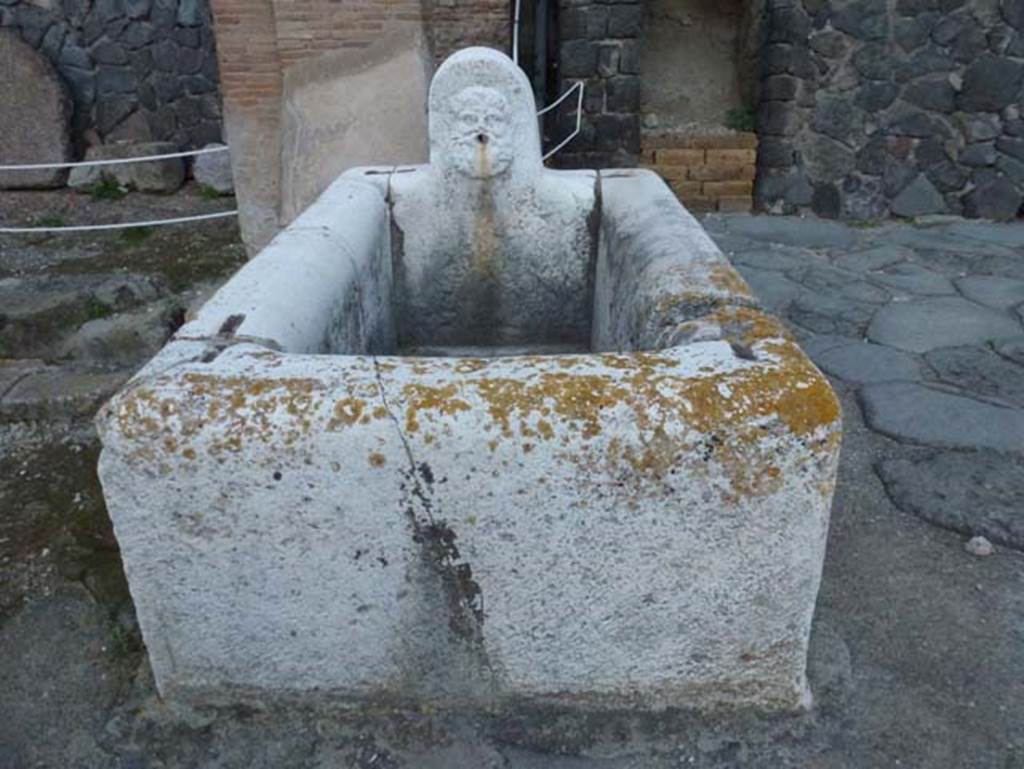 Decumanus Maximus, Herculaneum, October 2012.  Fountain decorated with head of Hercules, from fountain on east end of the Decumanus Maximus. Photo courtesy of Michael Binns.
