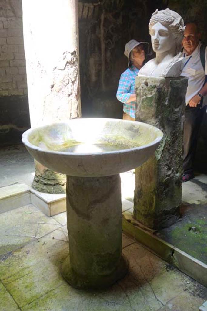 Fountain bust of Apollo, Suburban baths, Herculaneum. June 2014. Looking north-west in atrium with fountain bust of Apollo and basin.
Photo courtesy of Michael Binns. 
