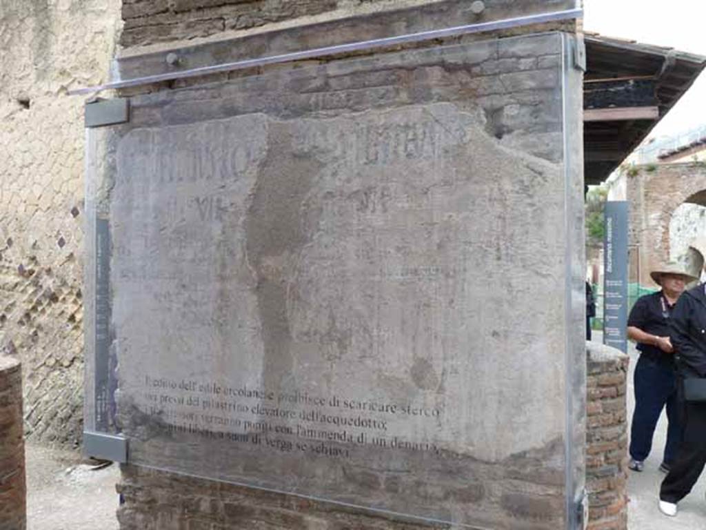 Water tower, at junction of Cardo IV Superiore and Decumanus Superiore, Herculaneum. May 2010. 
Painted edict on behalf of two local aediles, M. Rufellius Robia and A. Tetteius, to prohibit the dumping of dirt and excrement near to the water tower, to prevent the pollution of the water supply.
