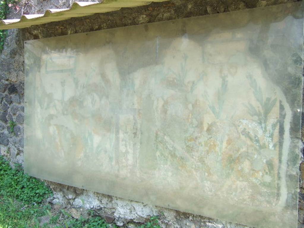 Left hand side of painted street shrine on the wall at V.6.19. December 2005.