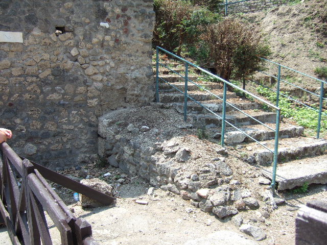 VI.7.26 Pompeii. West part of wall containing street altar which used to be at the north end of the Via di Mercurio.  