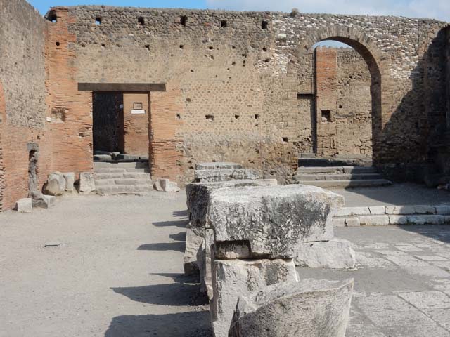 Arched Entrance in North West Corner of Forum. May 2010. Looking through Arch of Augustus to the arched entrance with its steps.