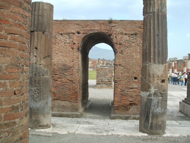 Arched monument at south end of Forum. January 2009. Photo courtesy of Rick Bauer. According to Mau, the four monuments arranged in a group, with the arched monument at the centre, were for the imperial family.