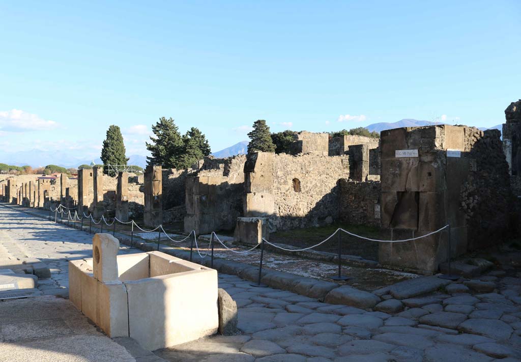 Fountain outside VII.9.67. Via dellAbbondanza, south side, Pompeii. December 2018. 
Looking south-east along Insula VIII.5, with VIII.5.1, on right. Photo courtesy of Aude Durand.

