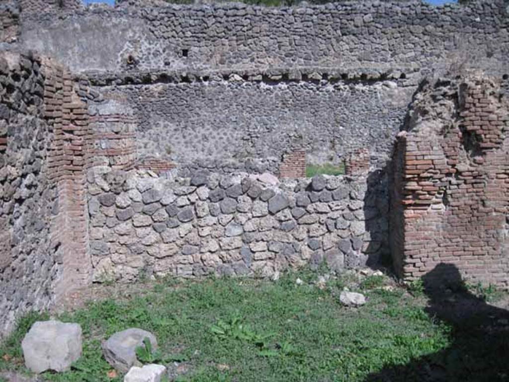 I.1.4 Pompeii. September 2010. East wall of rear room. Photo courtesy of Drew Baker.