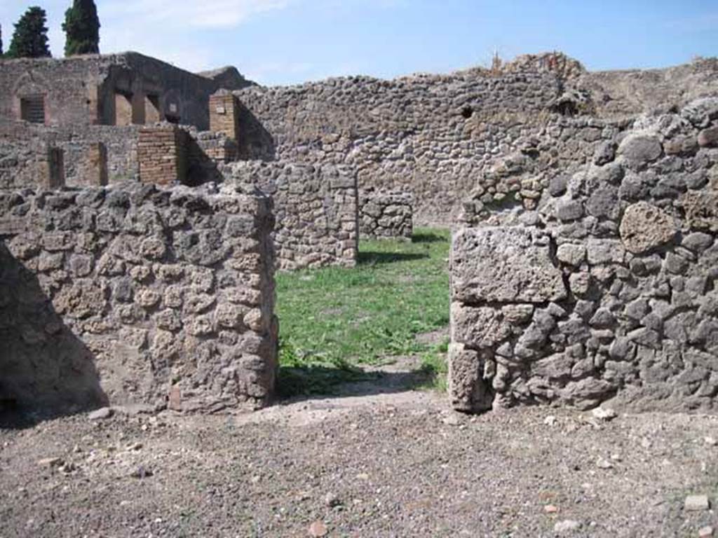 I.1.6 Pompeii. September 2010. Doorway in north wall leading to large room of I.1.8. Photo courtesy of Drew Baker.
