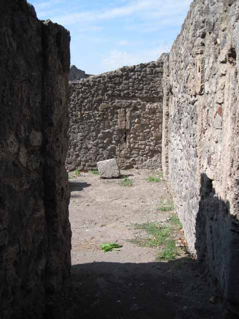 1.1.10 Pompeii. September 2010. View from wall showing side of I.1 looking north towards odeon Photo courtesy of Drew Baker.