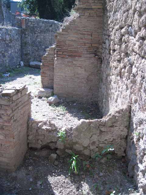 1.1.10 Pompeii. September 2010. Feature street altar on corner of 1.1, looking west. Photo courtesy of Drew Baker.