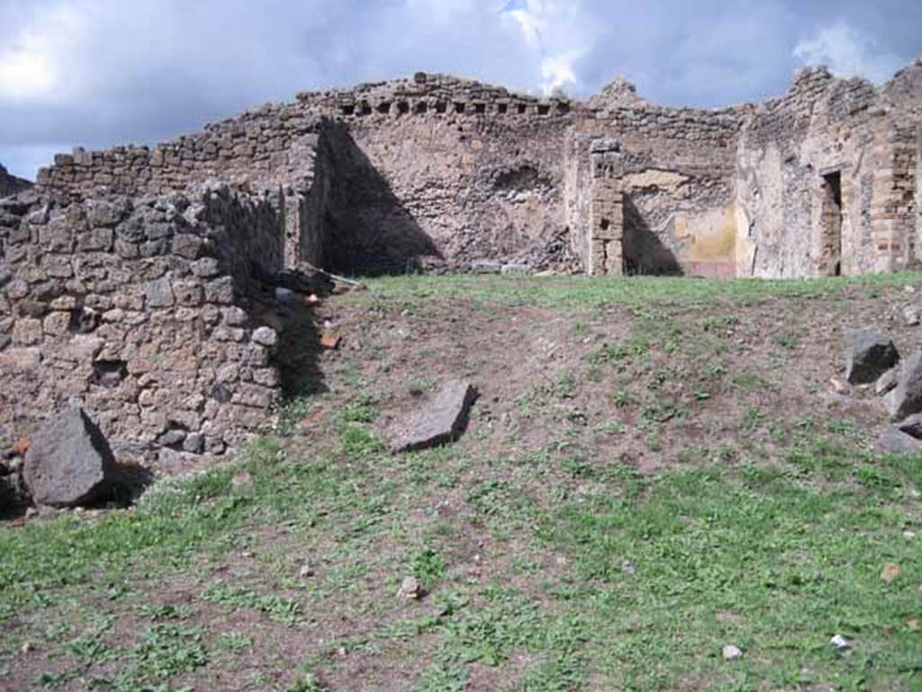 1.2.3 Pompeii. September 2010.  Looking north towards remains of middle part of north wall of atrium. The north wall of house at I.2.6 is visible at the rear. Photo courtesy of Drew Baker.

In this area (bombed in 1943) would have been the site of the two cubicula mentioned by Fiorelli. In one of them, he said, was antique decoration under the more recent restoration. The other contained two paintings, Polyphemus and Galatea and Ariadne abandoned by Theseus.
According to Fiorelli, there was a third painting which had been destroyed. Included on the walls were painted medallions enclosed in circles of wreaths of leaves, which were still visible. In one were Mars and Venus, in another Meleager and Atalanta, and in third was the head of a Bacchante. On the wall to the right was a small hollow covered internally with marble, probably to hold a lantern.
See Pappalardo, U., 2001. La Descrizione di Pompei per Giuseppe Fiorelli (1875). Napoli: Massa Editore. (p.34)
See Garcia y Garcia, L., 2006. Danni di guerra a Pompei. Rome: L’Erma di Bretschneider. (p.38, no.21 for photo of wall with Polyphemus and Galatea).
According to Warscher’s list from Prof.Sogliano, the paintings listed were all from the third cubiculum to the left of the atrium. Head of Bacchante, no. 199 on p.45, 
Polyphemus and Galatea, no. 474 on page 78, Heads of Atalanta and Meleager, no. 507 on page 89, Ariadne abandoned by Theseus, no.534 on page 97, Heads of Mars and Venus, no 605; and a female head (this one nearly all destroyed) no.606, on page 124).
See Warscher T., 1935. Codex Topographicus Pompeianus: Regio I.2. Rome: DAIR (after photo no.12).   
See Sogliano, A., 1879. Le pitture murali campane scoverte negli anni 1867-79. Napoli: (p. 45, 78, 89, 97, 124)




