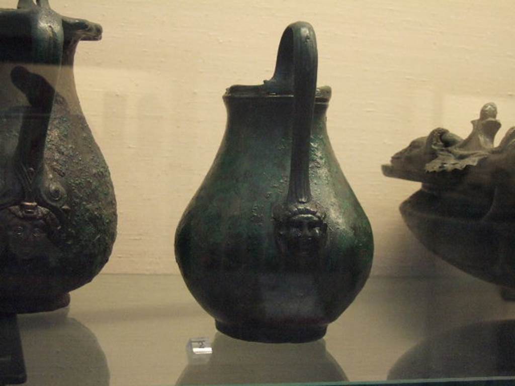 I.2.10 Pompeii.  Found in Tablinum. Bronze jug.  Now in Naples Archaeological Museum. Inventory number: 110053.