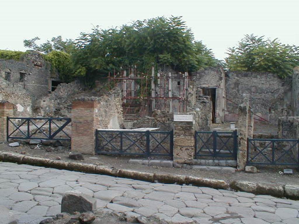 I.2.12, on left, Pompeii. September 2004. I.12.11, centre left, I.2.10, entrance at centre right, I.2.9, on right.