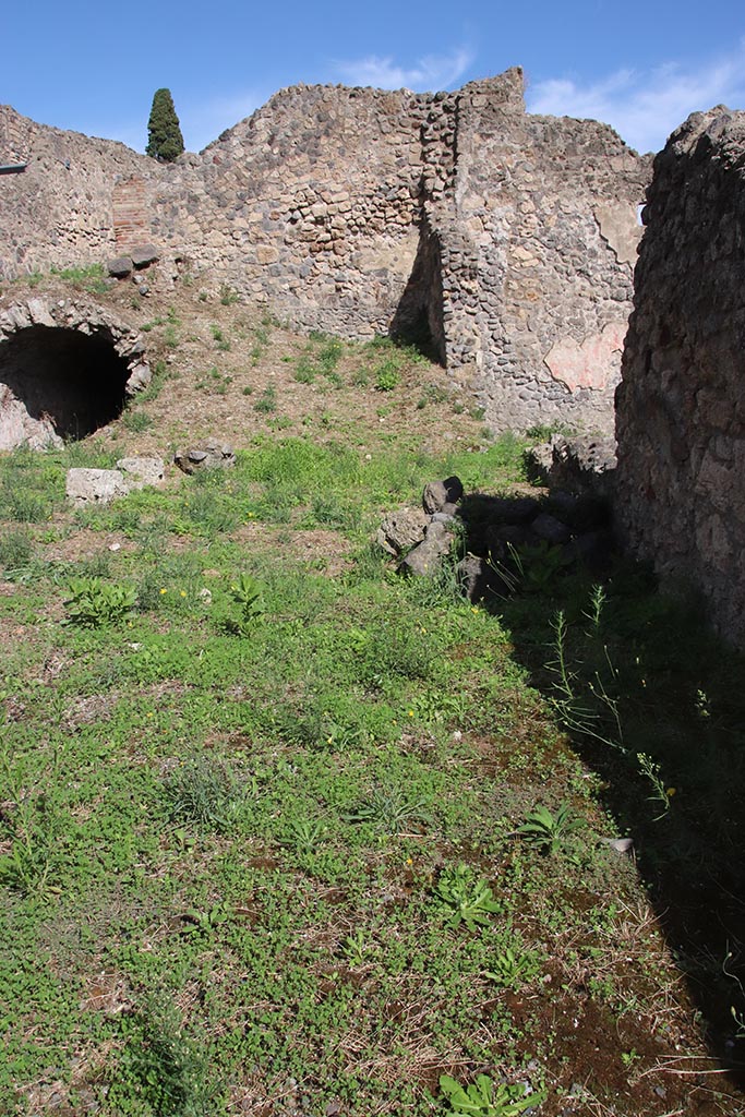 I.2.12 Pompeii. October 2024. Looking east into area of rear room. Photo courtesy of Klaus Heese.