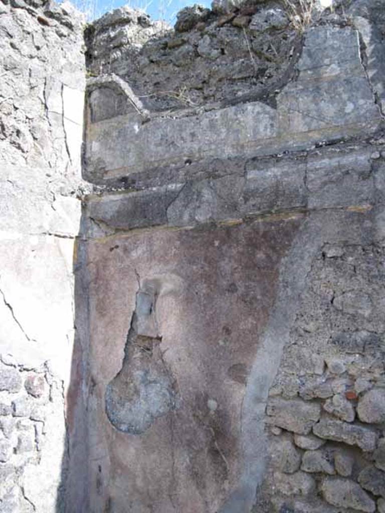 1.2.16 Pompeii. September 2010. Room 4, oecus, remaining first style decoration in south-east corner. Photo courtesy of Drew Baker.
