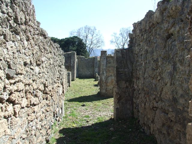 I.2.16 Pompeii.  March 2009. Doorway to Room 2. Kitchen? with Well and Stairs to upper floor.