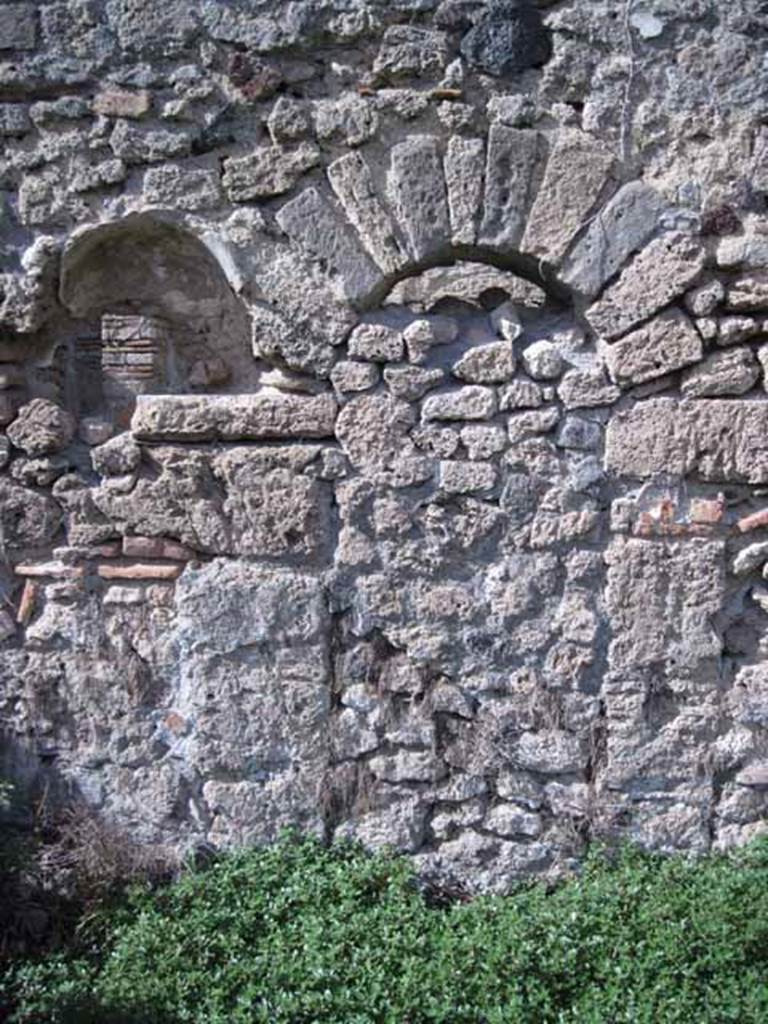 I.2.20 Pompeii. September 2010. Detail of blocked arch doorway and niche in north wall. Photo courtesy of Drew Baker.
