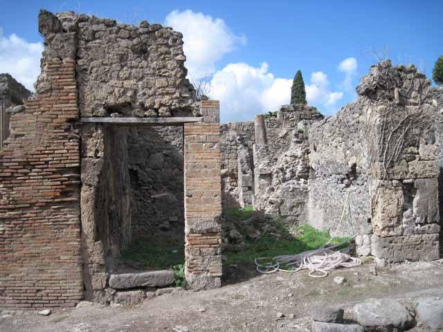 I.2.26 Pompeii. September 2010.  Looking north to entrance, on left, to steps to separate upper dwelling, across Vicolo del Conciapelle. Photo courtesy of Drew Baker.
According to Fiorelli, Gradinata per un piano sovrapposto, che pi non esiste.
(translation: Stairs to an upper floor, that existed no more).
See Pappalardo, U., 2001. La Descrizione di Pompei per Giuseppe Fiorelli (1875). Napoli: Massa Editore. (p.37)

