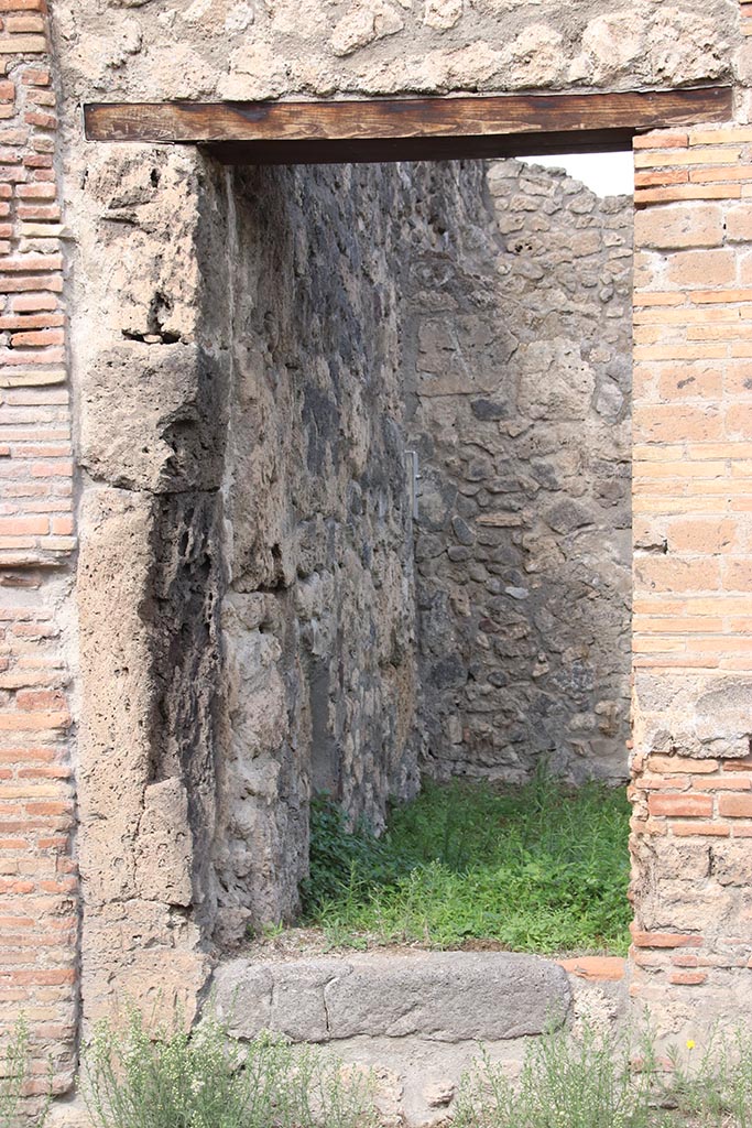 I.2.26 Pompeii. September 2010. Looking north into site of stairs to upper floor dwelling and workshop. Photo courtesy of Drew Baker.
